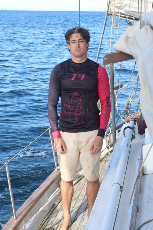 Person on a sailboat with a blue ocean background